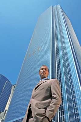 Curtis G Martin FWS Picture of a black man in front of a tall building.